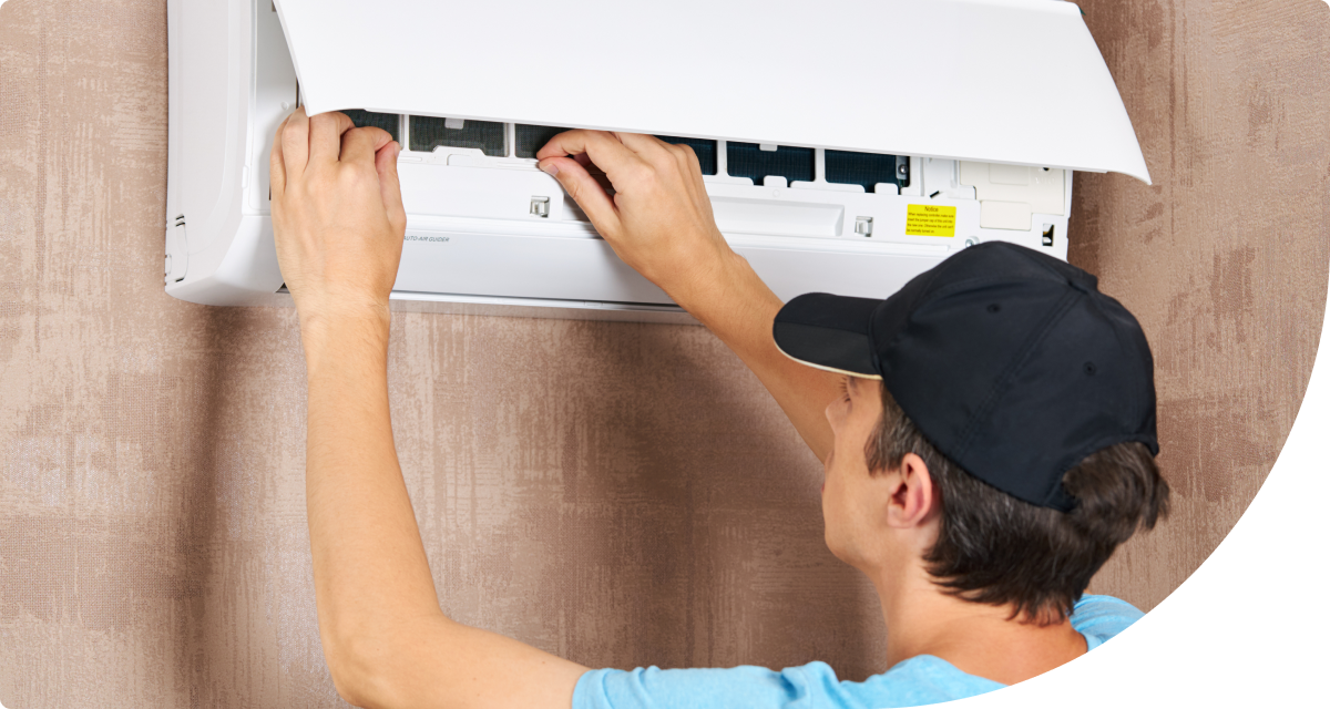 AC technician performing inspection