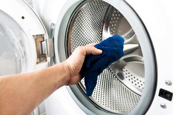 Cleaning a washer with rag