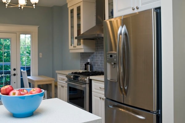 couple looking at refrigerator