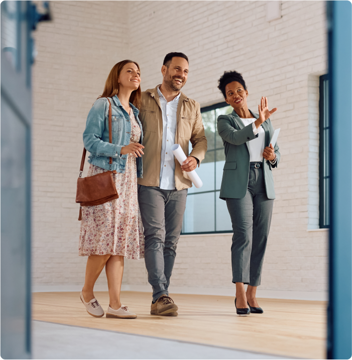 Real estate agent showing area to clients