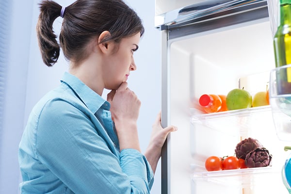 women looking through freezer