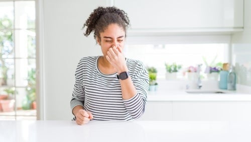 woman smelling smoke