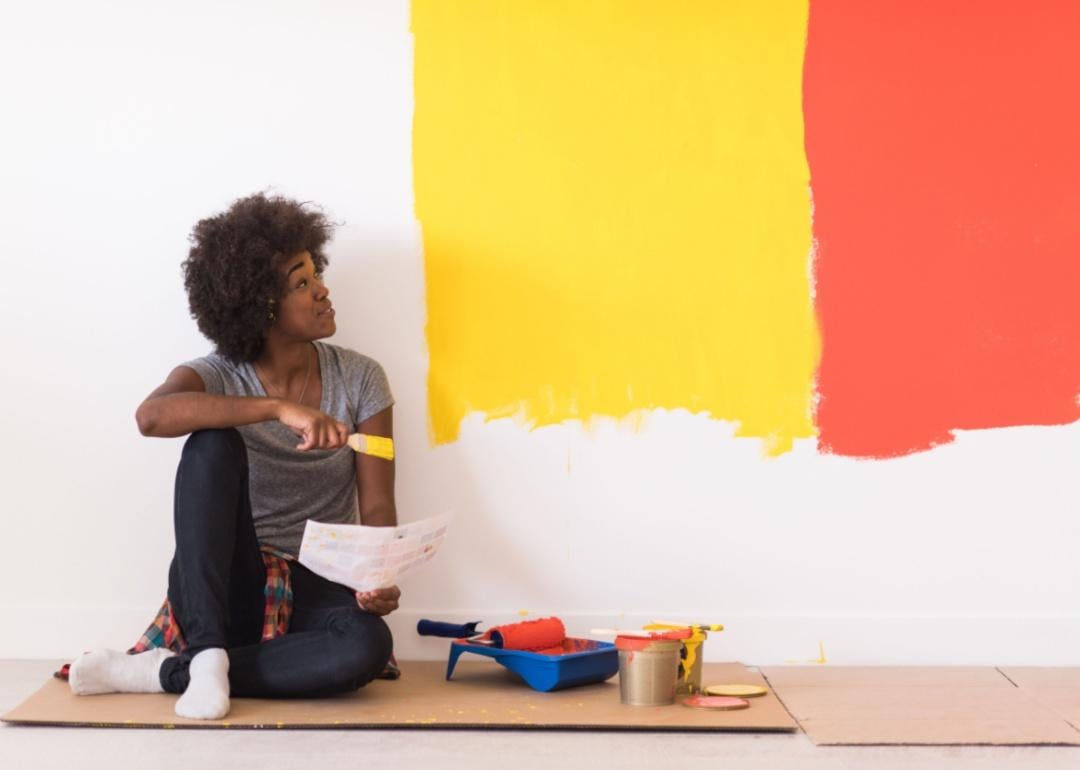 Women painting wall