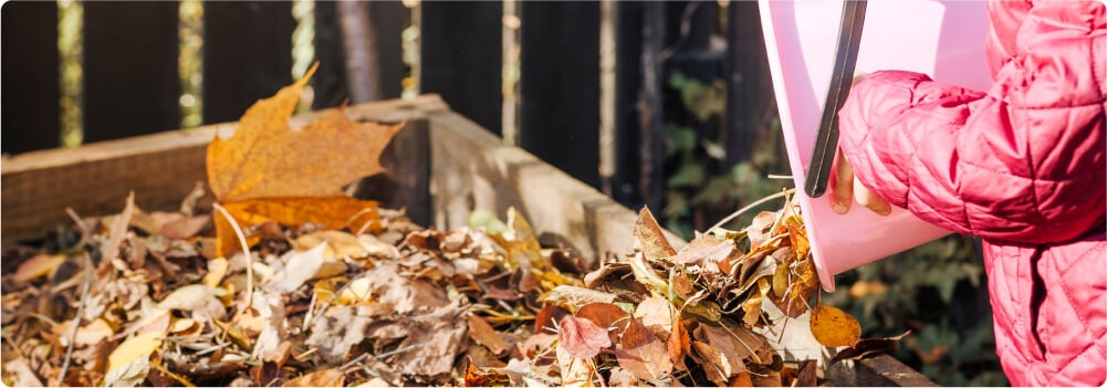 Person composting leaves