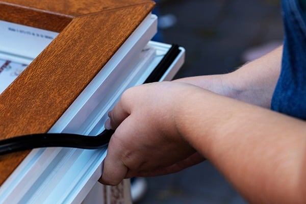 Weatherstripping a window frame