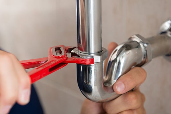 Plumber fixing a leak