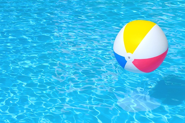 beach ball floating in pool water