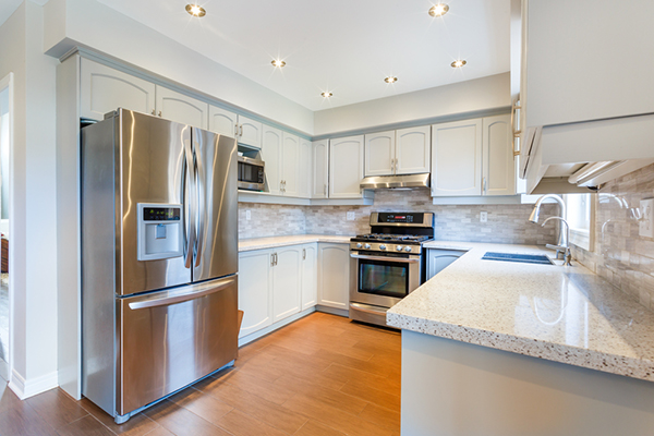 white kitchen with chrome appliances