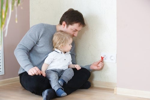 dad with baby near outlet