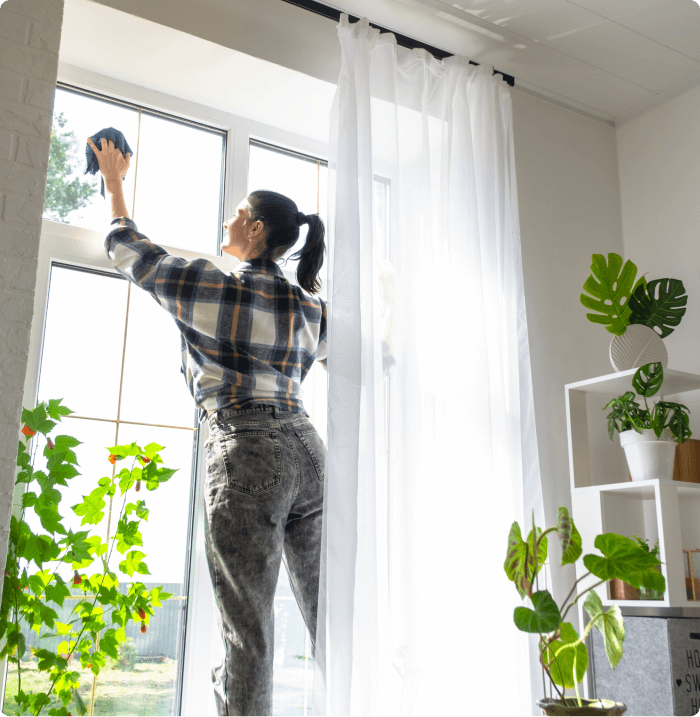 Woman cleaning windows.