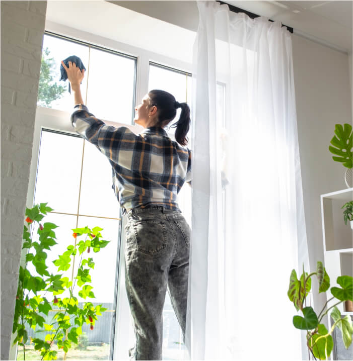 A woman cleaning windows