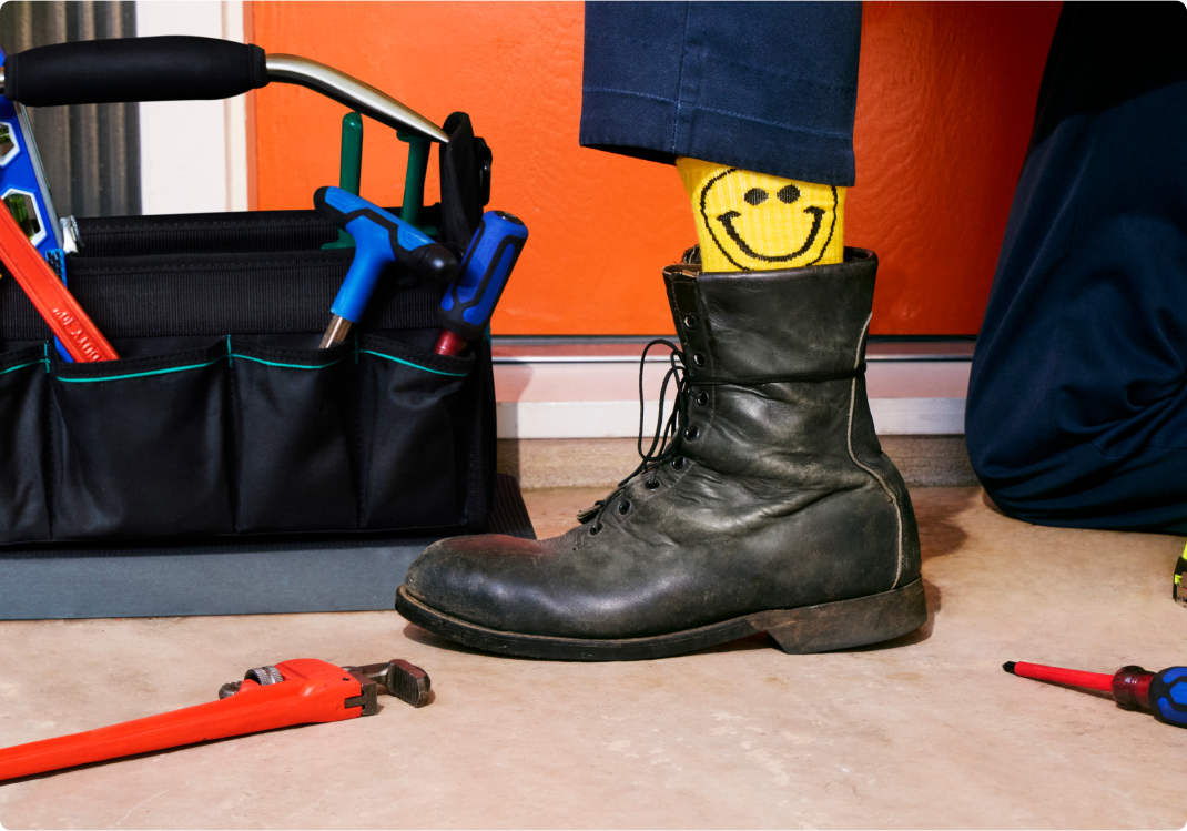 technician with smiley socks