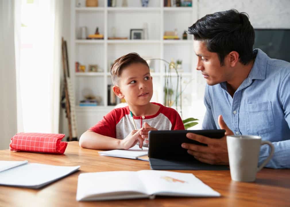 father and son doing homework