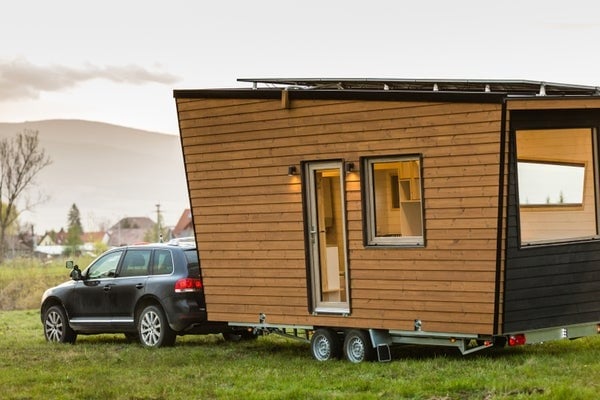 tiny home being hauled with truck