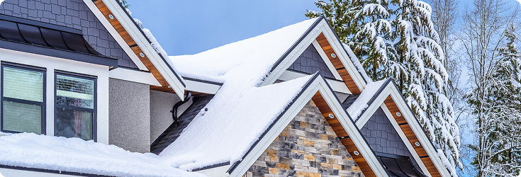 Peaked roof covered in snow