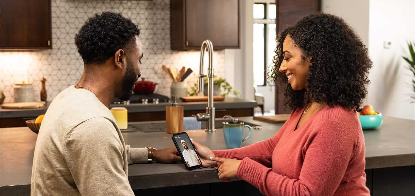 Couple having a live video conversation with an expert