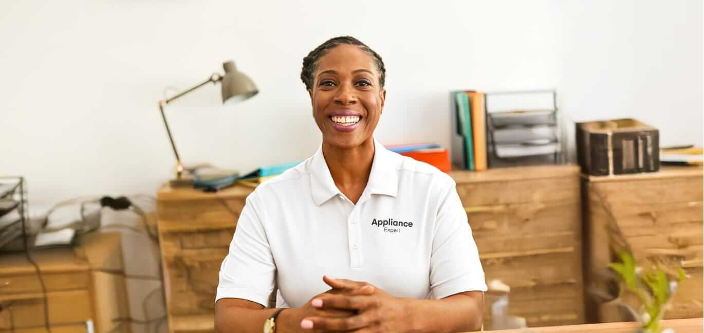 Appliance expert sitting at desk